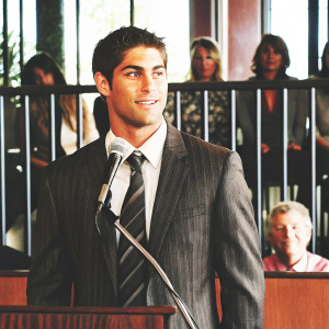 Jimmy Garoppolo, quarterback, during a press conference. Wearing a suit and tie. Indoor event with audience