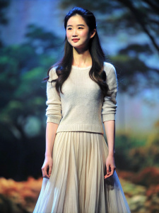 Skinny Liu Yifei looks cute in a beautiful long flowing skirt and thin cashmere sweater as she stares at the audience