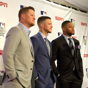 Mark Trumbo, Corey Seager, and Robinson Cano at the ESPN Home Run Derby press conference. All wearing suits, standing in front of a white backdrop.