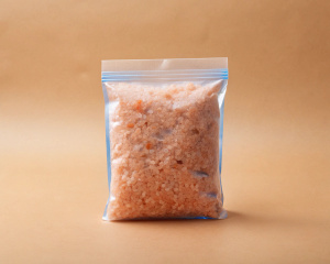himalaian pink salt in the blue package on the beige background