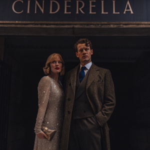 Laura Jayne Smith and Matt Smith at the British Film Institute gala. Laura wears a sparkling white gown and clutch, Matt in a charcoal suit with a deep blue tie. Blue backdrop and 'Cinderella' logo