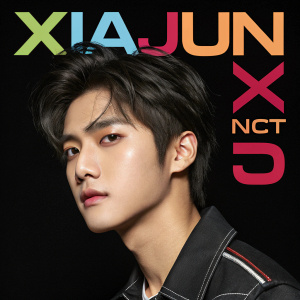 Promotional poster for Xiajun, a K-pop idol from NCT U. Close-up shot, serious look, black background, vibrant text overlays