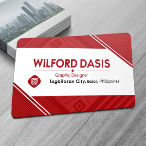 Professional business card design for Wilford Dasis, a graphic designer from Tagbilaran City, Bohol, Philippines. Card showcases company name, contact details, and website URL. Vibrant red and white color scheme.