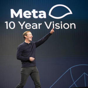 Mark Zuckerberg, CEO of Meta, in a dynamic pose at the company's annual conference. Behind him is a sleek, modern backdrop with the Meta logo and '10 Year Vision' text.