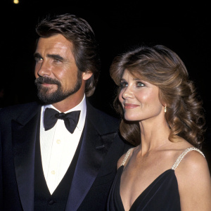 James Brolin and Jan Smithers at the Academy Awards. Both in formal attire. Black background.