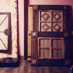 Concept art for video game Overhaul III. Inspired by Crash Bandicoot, featuring distressed wood aesthetic. Detailed with wooden elements in various shapes and sizes. Soft, pastel background.