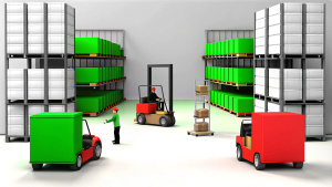 Warehouse, interior view, rows of shelving and electric carts. Employees are working in the background. Pallets with goods are placed on the racks