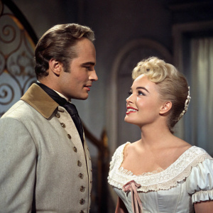 Marlon Brando and Shirley Jones in a vintage movie scene from the classic film 'Bedtime Story' (1964).