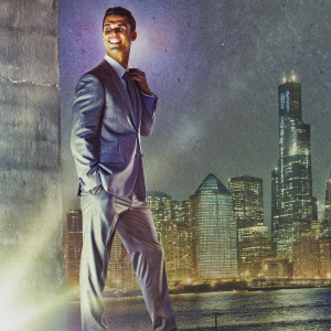 Cristiano Ronaldo in a formal suit, posing for a magazine cover. City skyline backdrop
