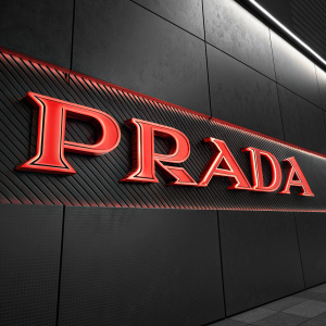 Modern digital render of Prada logo. Red text on sleek black background. Dynamic design with bold, thick lines. Centered and prominent
