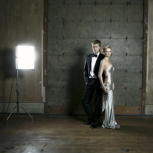 Chad Michael Murray and Paris Hilton at a glamorous awards ceremony. Dark, moody backdrop