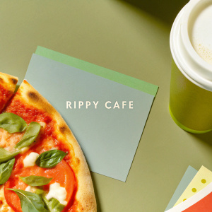Business card for Rippy Cafe. Features a coffee cup on one side and a pizza slice on the other. Main colors are grey, with green and brown highlights.