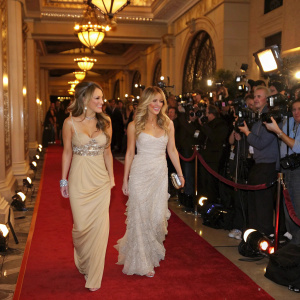Haylie Duff and Hilary Duff walking down the carpet of 'Entourage' premiere. Luxurious venue and photographers.