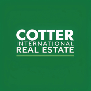 Corporate logo design for COTTER International Real Estate. Bold sans-serif font on a vibrant green background.