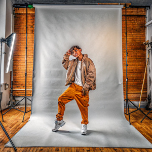 Jay Park in a Reebok Classic photoshoot. Brightly lit studio setting.