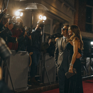 Robert Downey Jr. and Deborah Falconer at the glamorous premiere of a new film. Red carpet, flashing cameras, celebrities