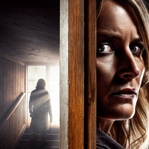 Serious face of the actress from 'The Cabin in the Woods'. Dark, mysterious atmosphere with dimly lit background.