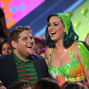 Jonah Hill and Katy Perry at the lively Nickelodeon's Kids' Choice Awards. Surrounded by colorful slime and enthusiastic audience.