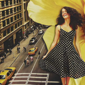 Abigail Spencer in a vibrant photo shoot. Wearing a black and white polka dot dress. Smiling brightly against a busy city street background