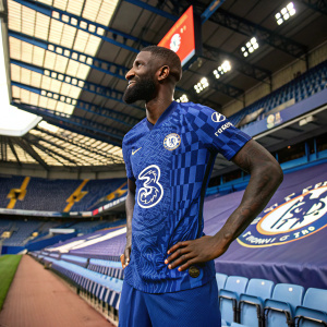 Antonio Rudiger, Chelsea FC player, posing solo with his new jersey. Stadium background