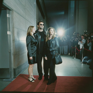 Anthony LaPaglia, Bridget LaPaglia, and Gia Carides at the New York City premiere of 'The Guardians'. Wearing black outfits, red carpet scene with flashing cameras.