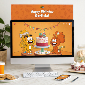 Interactive webpage celebrating Garfield's birthday. Vibrant orange theme, featuring beloved cartoon characters. 'Happy Birthday Garfield!' banner at top. Includes section for merchandise and Google Play logo. Designed to engage and entertain visitors.