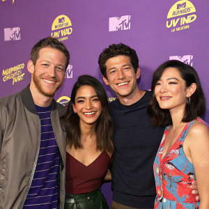 Jared Kusnitz, Jared Habel, Inbar Lavi, and Michelle Ang are posing for a group photo at an MTV event. Purple backdrop with MTV and Awkward logos. Friendly smiles.