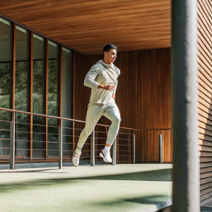 Cristiano Ronaldo in a dynamic action pose. Dark background, sleek modern design.