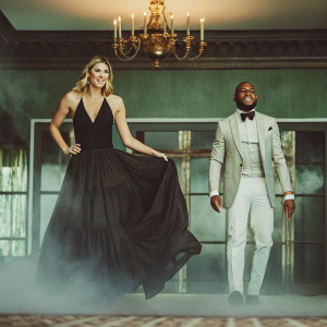 Maria Sharapova and Floyd Mayweather Jr at the ESPY Awards, posing together with the backdrop of a lavish ballroom.