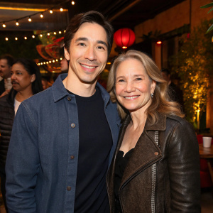 Justin Long and Wendy Lesniak at the premiere party. They both wear casual outfits, smiling warmly.