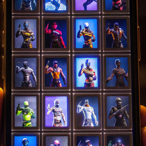 Grid layout of avatars from Fortnite, each in unique outfits and poses, captured from mobile device screen