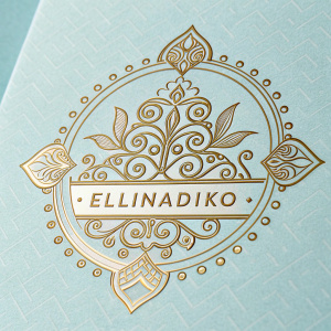Digital representation of 'Ellinadiko' logo. Light blue background. Intricate golden design. Sophisticated look