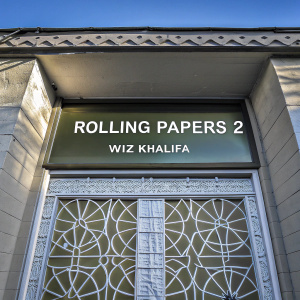 Album cover for 'Rolling Papers 2' by Wiz Khalifa. The cover features a green backdrop with intricate white geometric patterns and a list of song titles in the center.