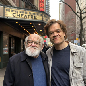 Candid photo of actors Ed Asner and Michael Shannon. Ed Asner, older man with full white beard and glasses. Michael Shannon, in casual attire, standing near a theater. Urban street backdrop with distinctive signage.