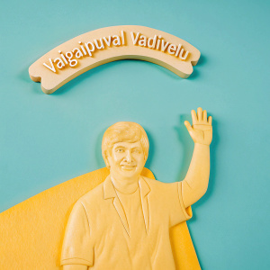 Digital illustration of Vaigaipuyal Vadivelu in cartoon style. Warm brown backdrop, sketchy texture. Tamil text above. Waving gesture.