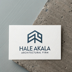 Business card for Hale Akala Architectural Firm. Modern design, white background, dark logo. Logo features stylized letters in contemporary font. Card includes contact information. Flat lay image highlighting card's aesthetic and branding.