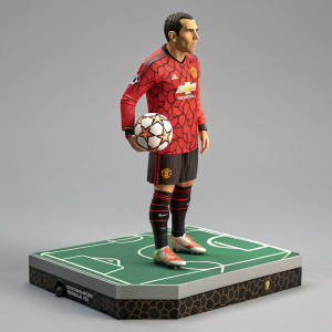 3D action figure of Carlos Tevez. He's dressed in a vibrant red jersey with unique patterns. Stands on a platform decorated with soccer field graphics. Posed in a determined stance, clutching a soccer ball.
