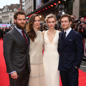 Henry Cavill, Rebecca Ferguson, Vanessa Kirby, and Frederick Schmidt at premiere event. The bustling crowd and paparazzi in the background.