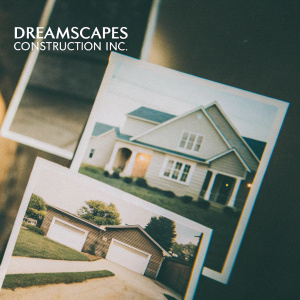 Homepage of Dreamscapes Construction Inc. showcasing a clean layout with multiple images of residential construction projects. Highlighting services through text and images, emphasizing landscaping and construction experience.