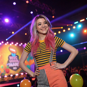 Jessie Paege at the annual Nickelodeon Kids' Choice Awards, striking pose with bright stage lights in the background.