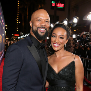 Common and Angela Rye at the Hollywood premiere. Red carpet event. Both smiling widely.