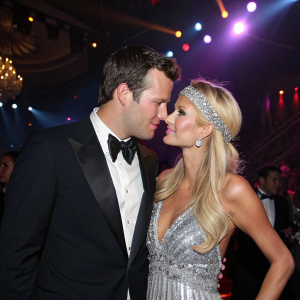 Doug Reinhardt and Paris Hilton at the premiere party. Both dressed formally, Doug in a tuxedo and Paris in a stunning silver sequined dress. They share an intimate moment under bright stage lights.