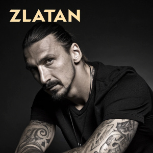 Photograph of Zlatan Ibrahimovic with intense stare. Intricate tattoos visible. Bold 'ZLATAN' text in stylized font. Dark and moody atmosphere