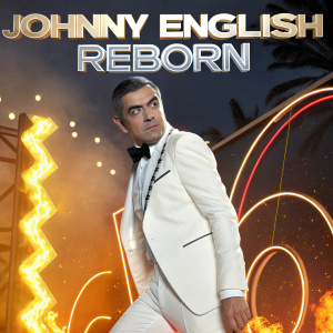 Rowan Atkinson, dressed in white tuxedo, poses amidst neon lights and abstract shapes. Imposing movie poster for 'Johnny English Reborn'. Fiery orange and yellow hues surrounding
