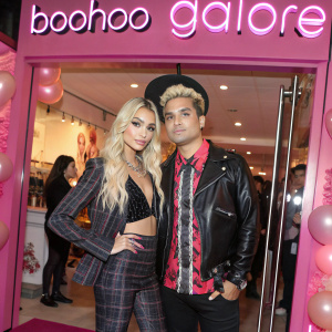 Pia Mia and Peter Michael Jude Perez at the LA Pop-up Store Launch Party for boohoo.com. Pink backdrop with boohoo and Galore text