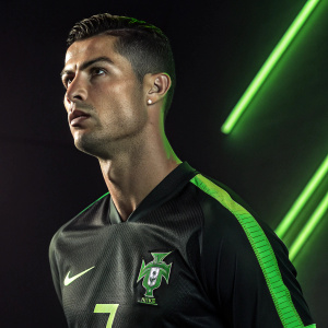 Cristiano Ronaldo in a Nike commercial, intense expression, wearing black and green jersey. Number 7 prominently displayed. Dark background with neon green highlights.
