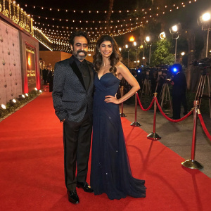 Sonu S. Ahluwalia and Pooja Batra attend a glitzy Bollywood gala. Red carpet and flashing cameras.
