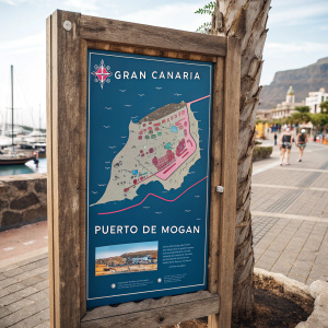 A detailed map of Gran Canaria's Puerto de Mogán. The map's weathered frame and vibrant blue and pink hues highlight key landmarks and hidden spots. Ancient script on the map shares tales of the region's rich history.
