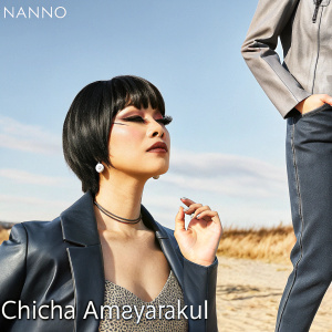Chicha Amayatakul from 'NANNO', sporting a sleek, dark bob haircut. Asian-inspired makeup and fashion.