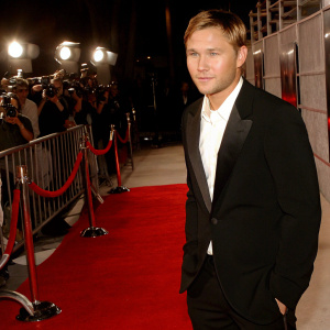 Brian Geraghty at the Hollywood premiere of 'Jarhead'. Red carpet event, flashing cameras, wearing a black tuxedo